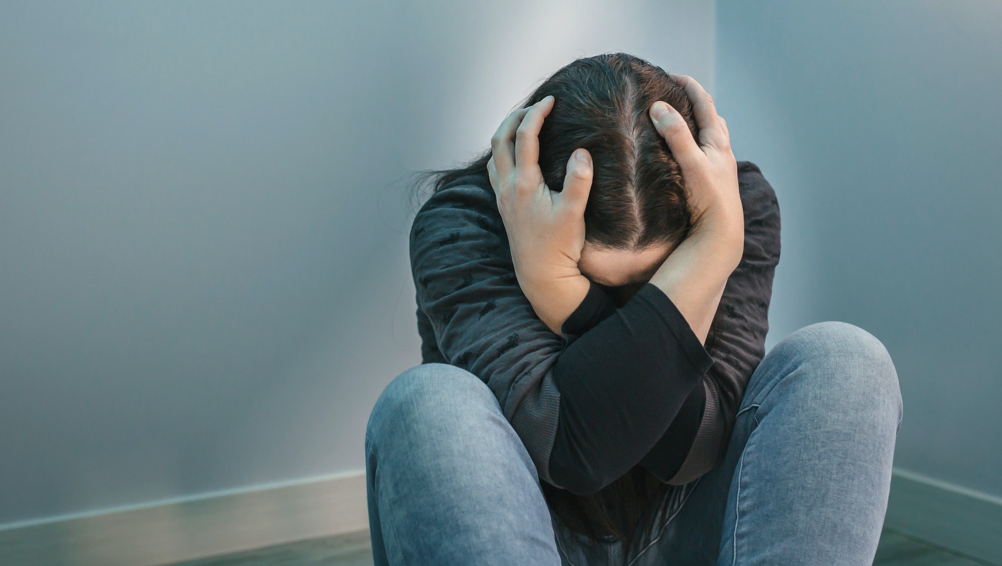 Unrecognizable woman with mental disorder and suicidal thoughts
